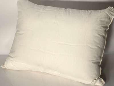 These pillows are filled with Kapok fibers and covered in unbleached and undyed certified organic cotton ticking.